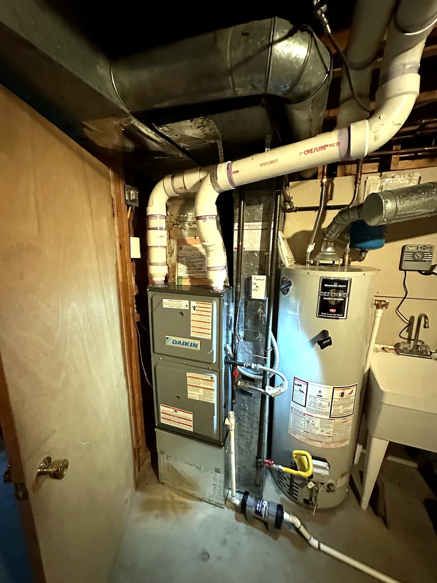 New Daikin high-efficiency gas furnace and water heater in a Denver metro basement